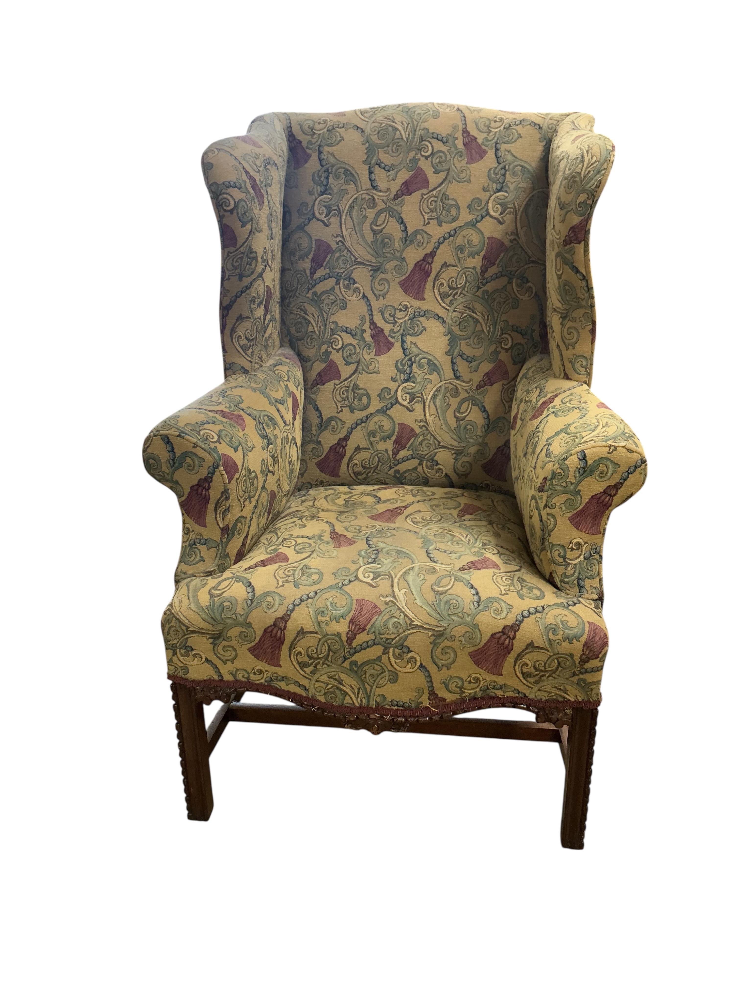 A George III style upholstered wing armchair, width 78cm, depth 66cm, height 103cm
